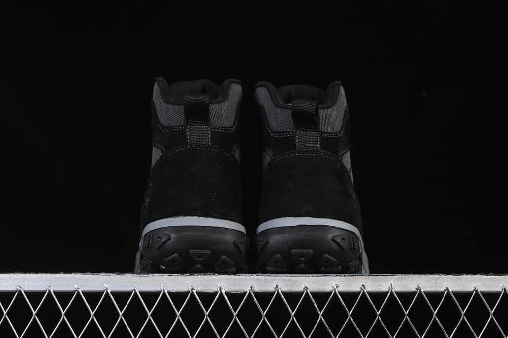 Rear view of the pair showing the heels and outsoles.