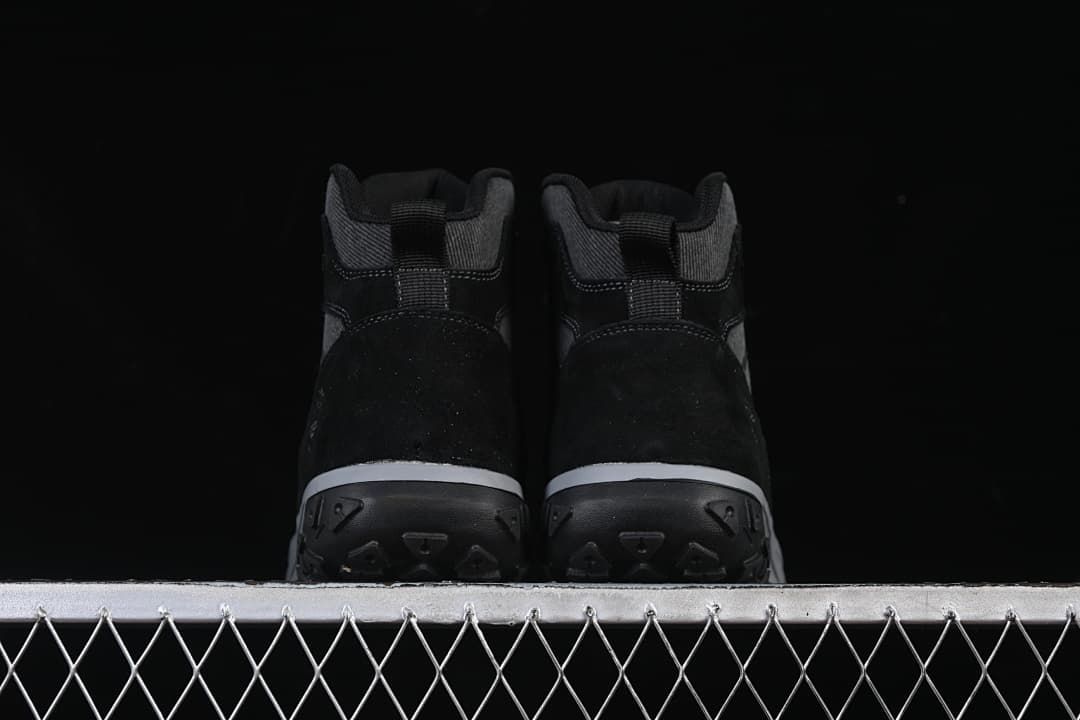 Rear view of the pair showing the heels and outsoles.