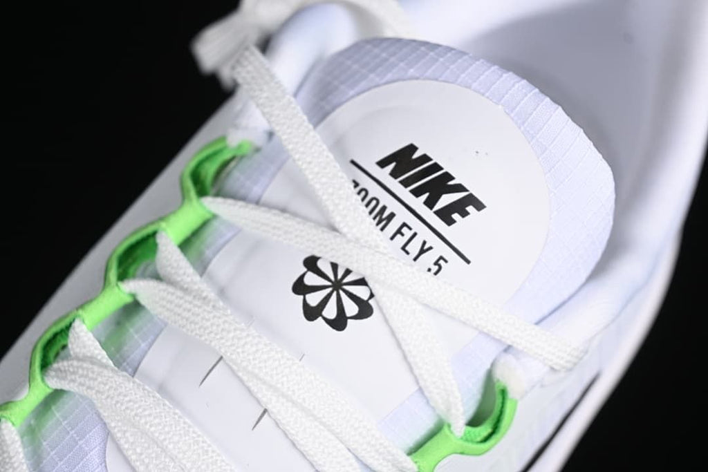 Close-up of the tongue marked Nike Zoom Fly 5 and white laces with green lace details