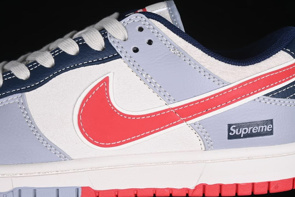 Close-up of red side Swoosh, gray overlays and Supreme side detail