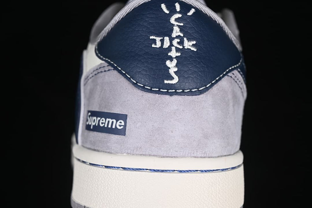 Rear view showing navy heel panel and branded heel details