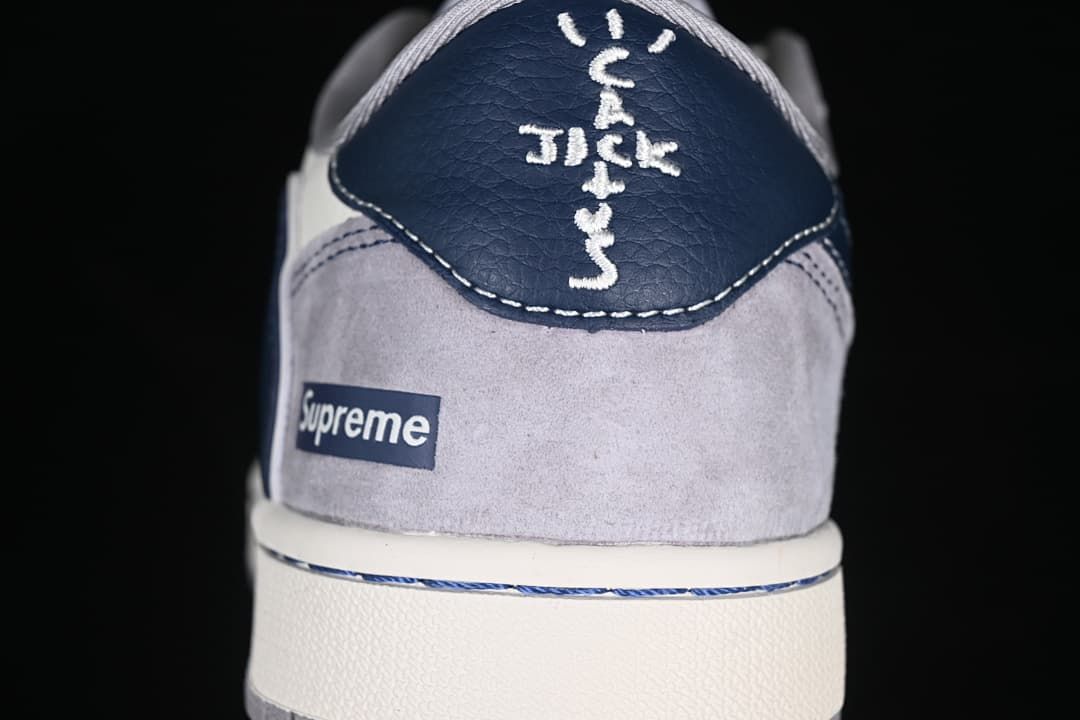 Rear view showing navy heel panel and branded heel details
