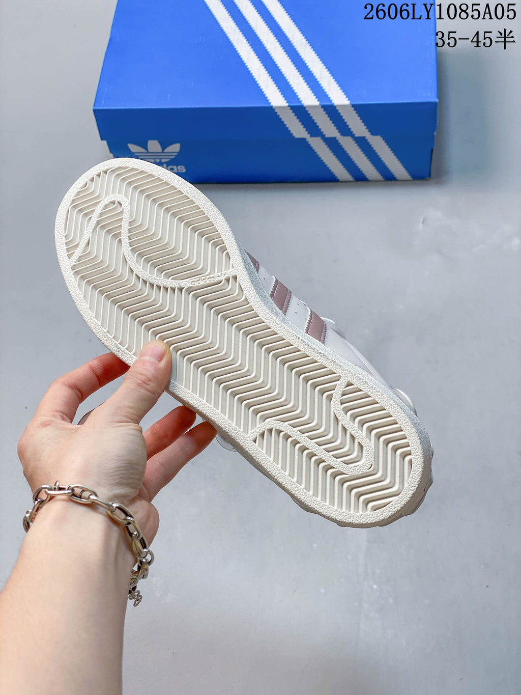 Underside view of the Adidas Superstar sneaker showing its patterned outsole.