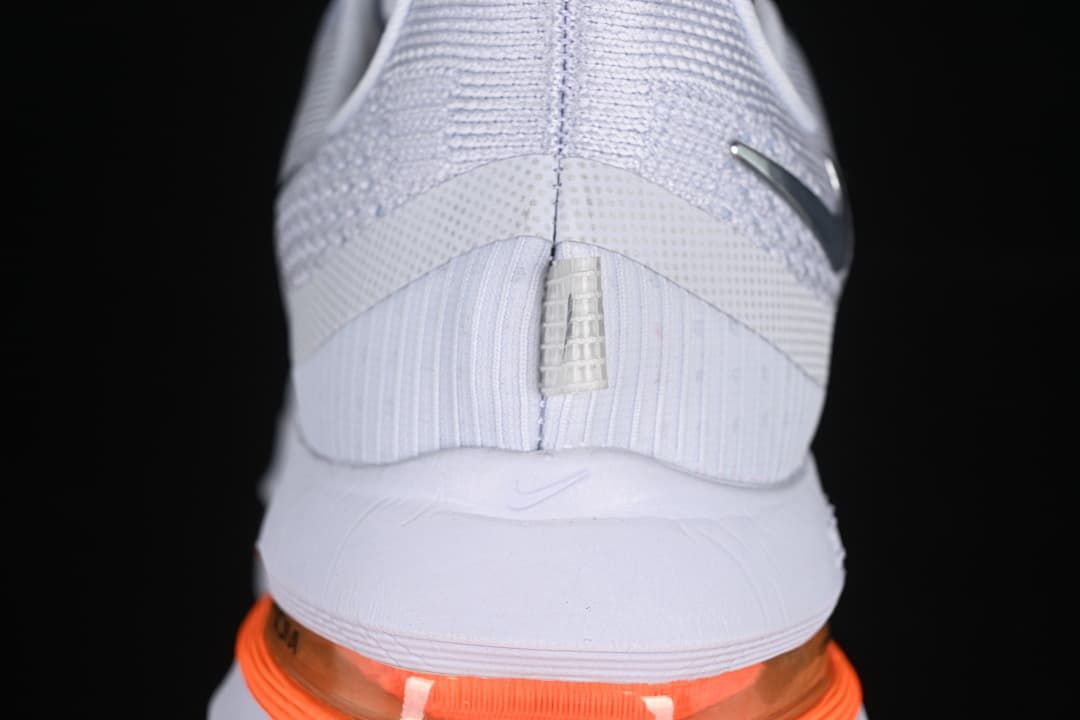 Rear view highlighting the heel and orange cushioning element