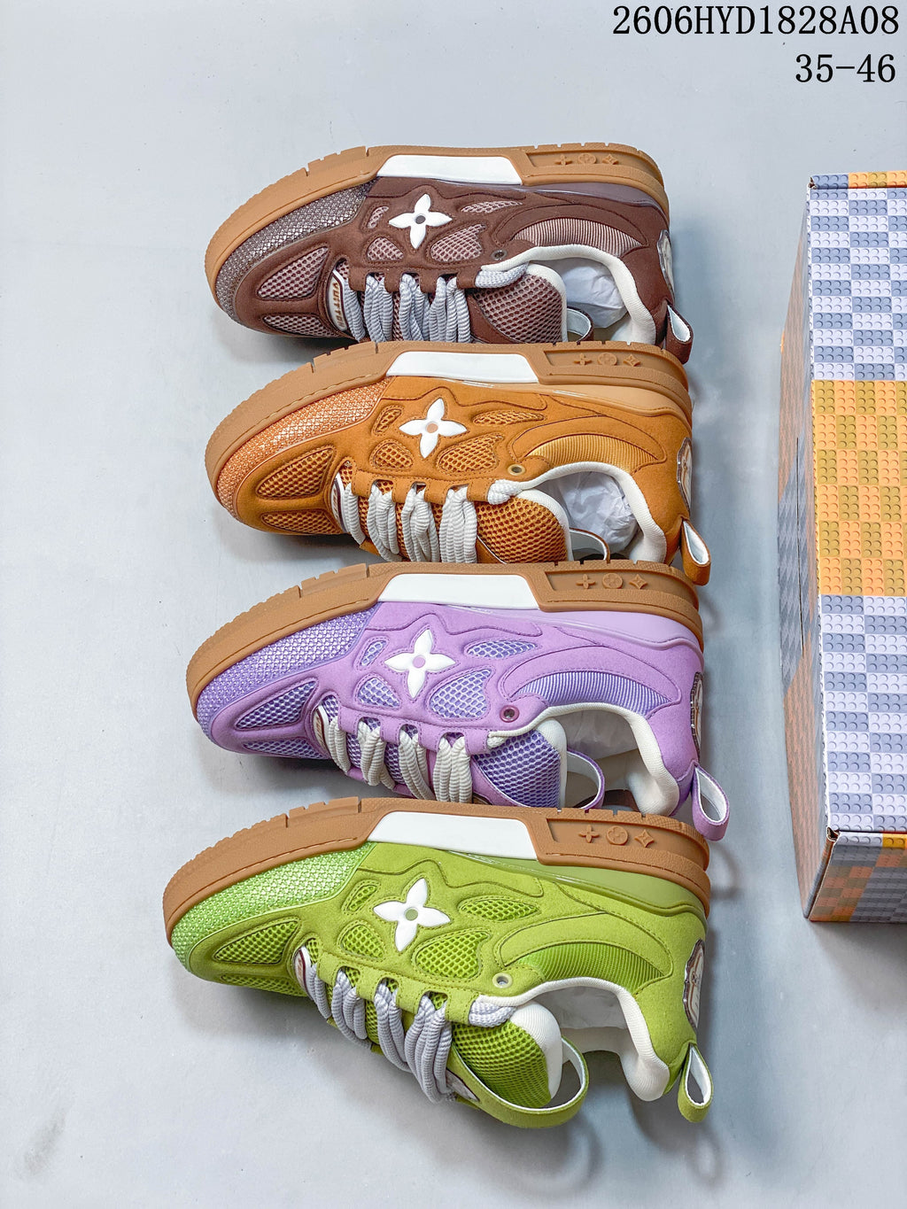 Side view of four sneakers in brown, orange, purple, and lime green colorways.