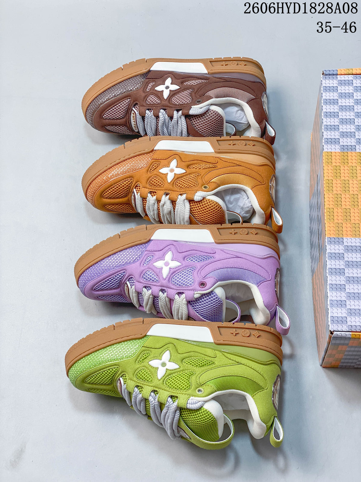 Side view of four sneakers in brown, orange, purple, and lime green colorways.