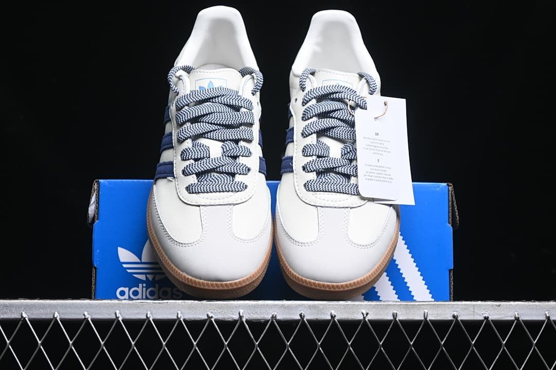 Front view of the pair with patterned laces and gum-colored outsoles.