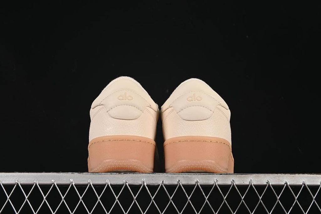 Rear view of the pair showing heel panels and gum-tone soles