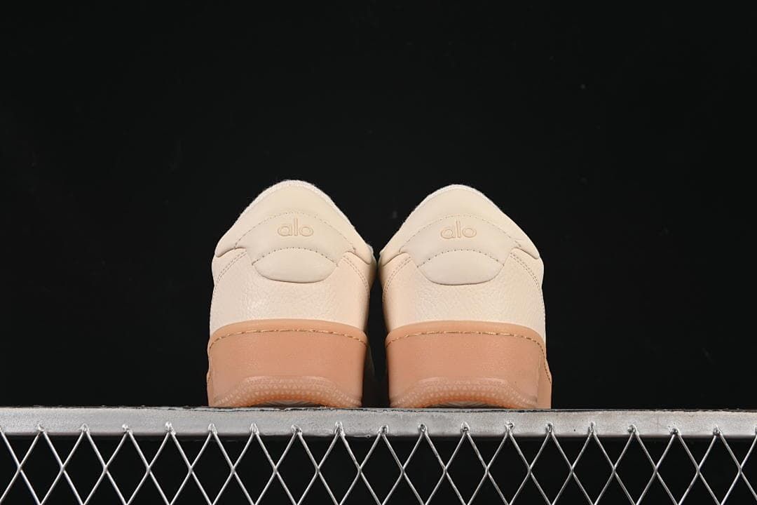 Rear view of the pair showing heel panels and gum-tone soles