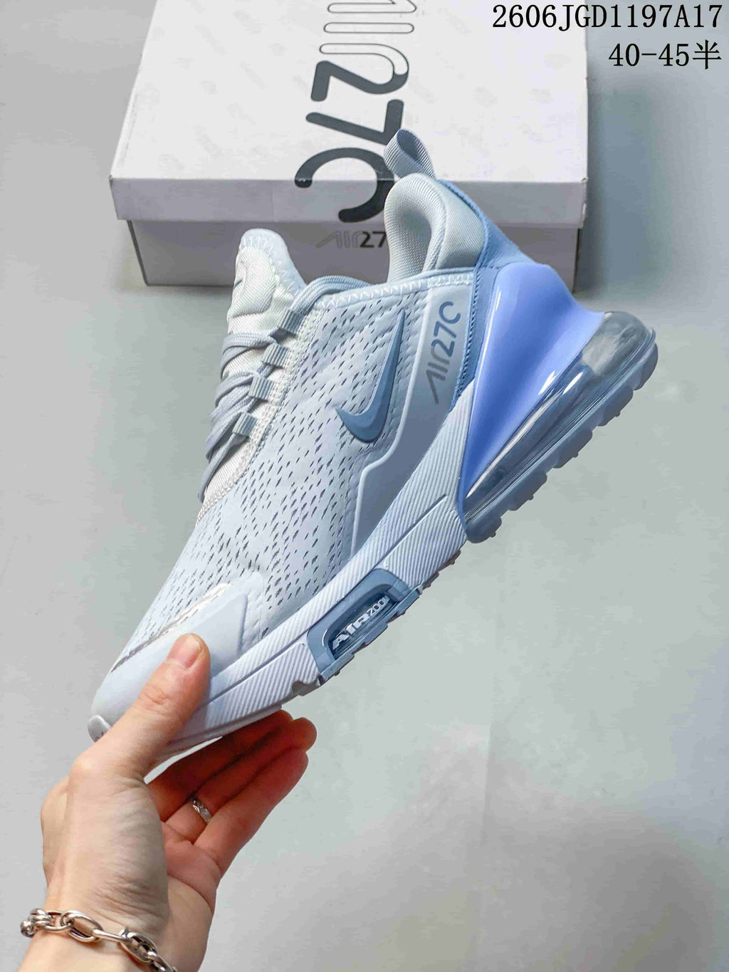 Side view of the white and pale blue Nike Air Max Pulse shoe