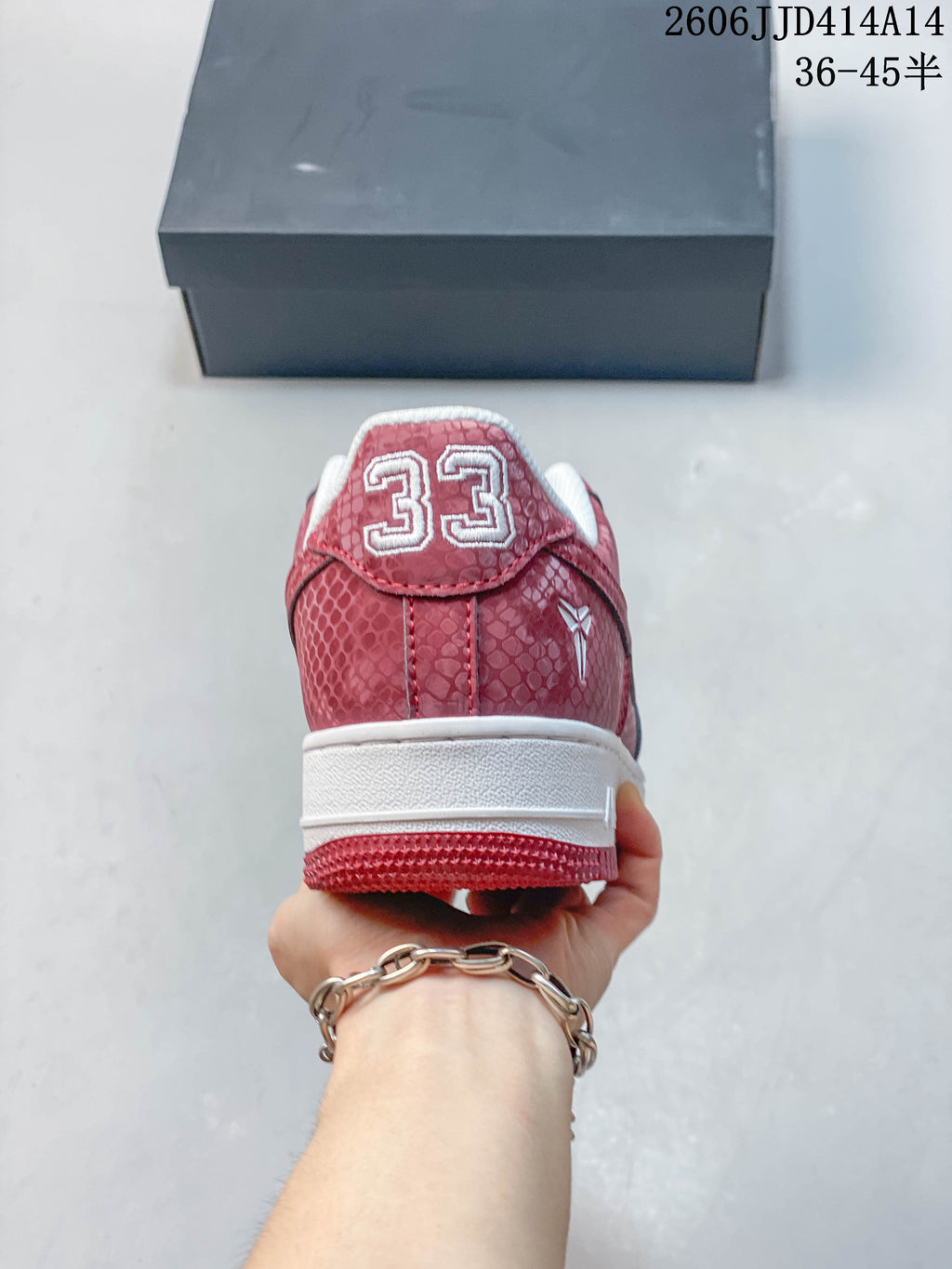 Rear view showing the patterned heel and embroidered number detail