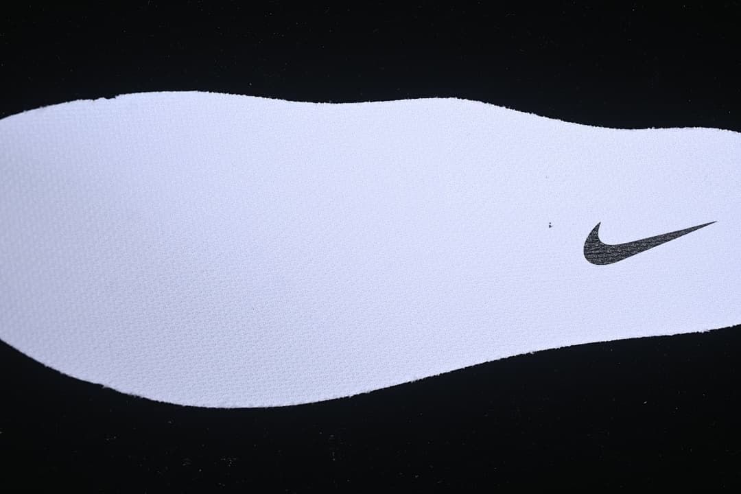 Close-up of the white insole with a small black Swoosh.