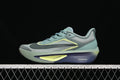 Side view of Nike Zoom Fly 6 running shoe in blue-green, gray, pale yellow, and purple tones