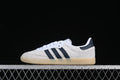 Side view of a white adidas Samba OG sneaker with navy stripes and a gum-look sole