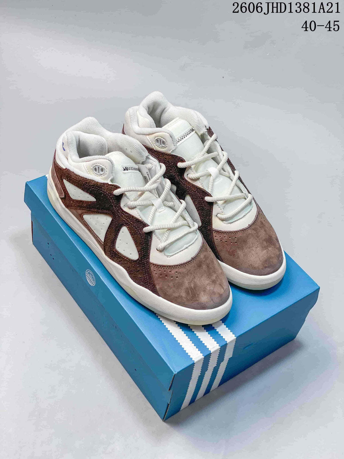 Taupe, brown, and off-white Badbo 1.0 high-top sneakers displayed on a blue shoe box