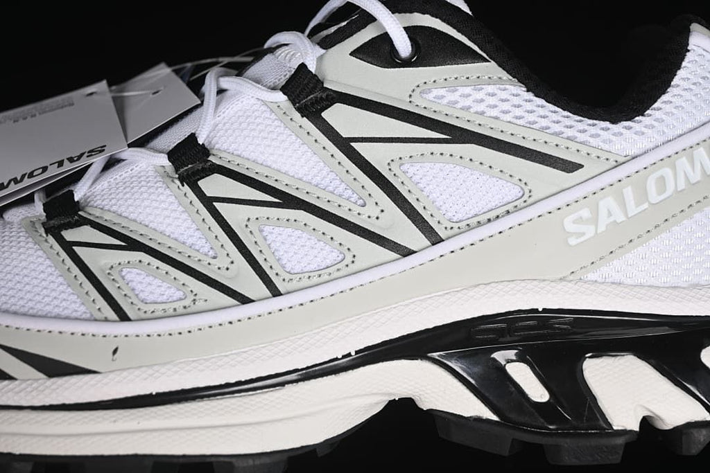 Close-up of the side overlays, mesh upper, and lace attachments.