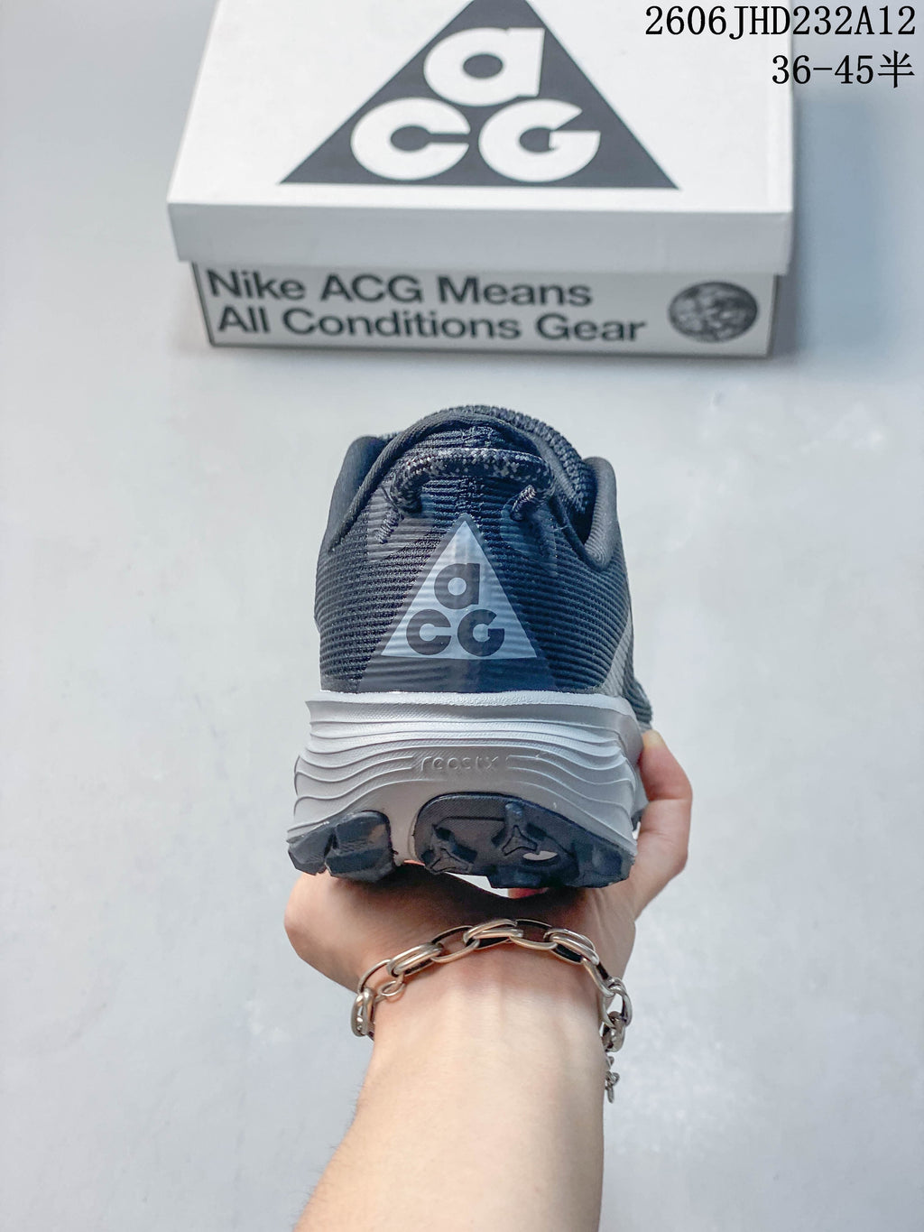 Rear view of the shoe showing the ACG heel logo and layered midsole