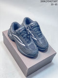 Pair of charcoal Raf Simons Cylon-21 low-top sneakers viewed from above and at an angle
