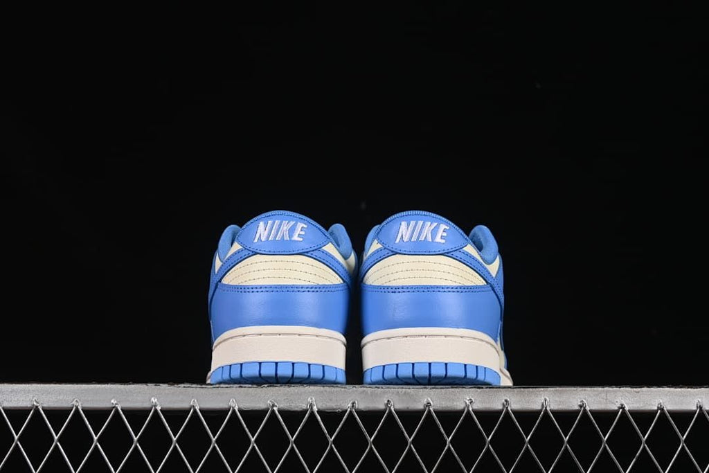 Rear view of the pair showing blue heel panels and cream accents