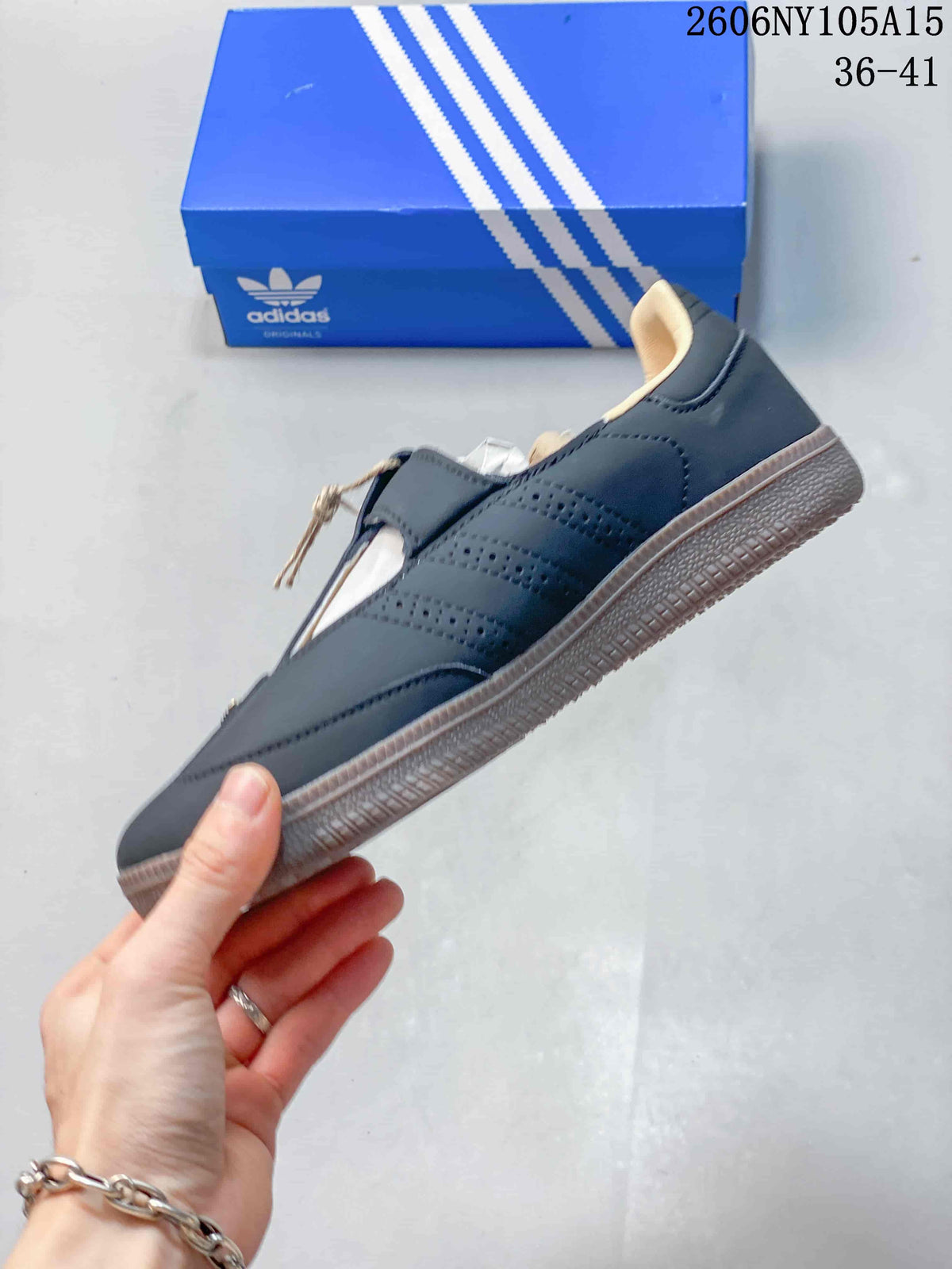 Side view showing perforated panels and the gum-colored outsole of the Samba Jane shoe.