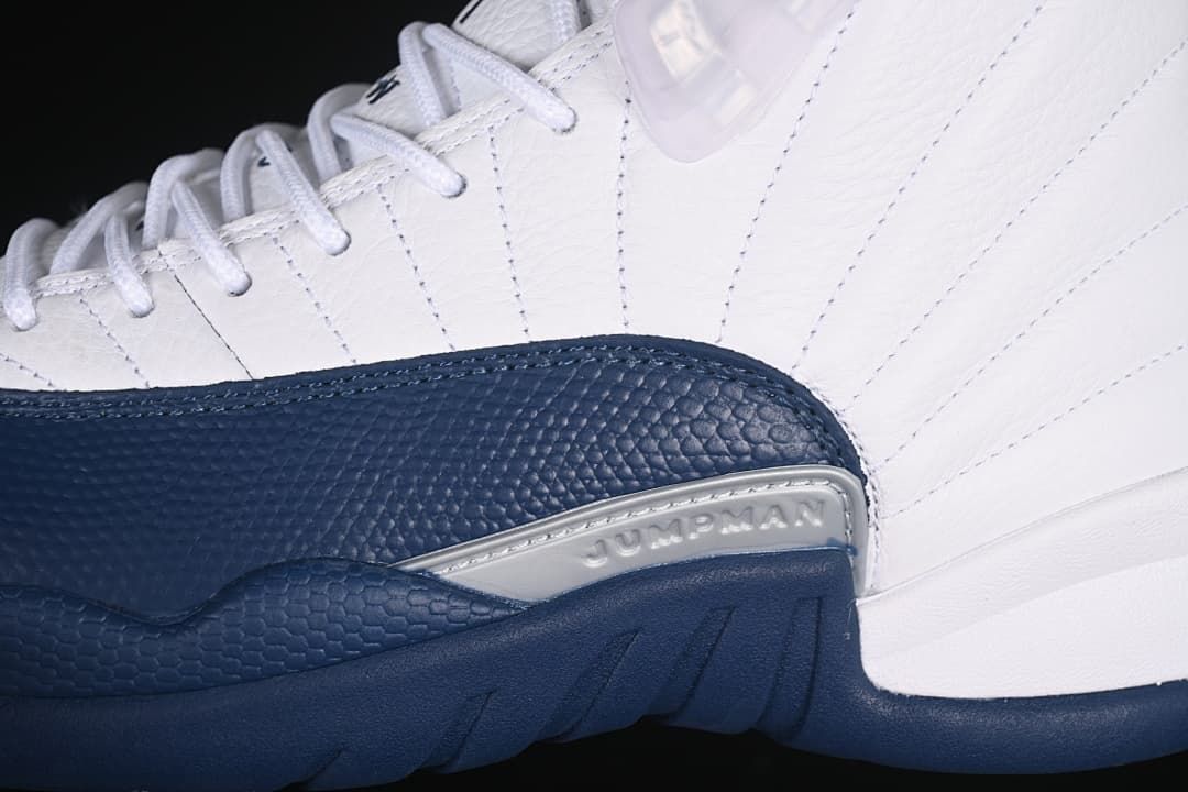 Close-up of navy textured overlay and silver-tone side detail