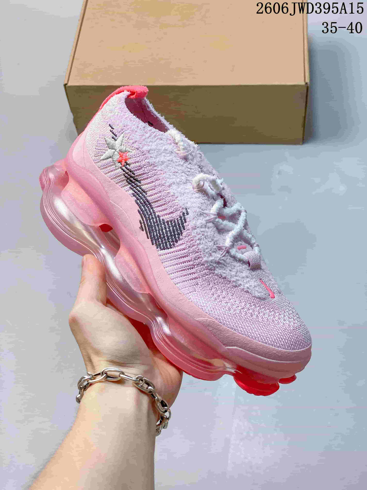 Pale pink knit sneaker with a dark side mark and pink sculpted sole; image also shows the text 35–40.