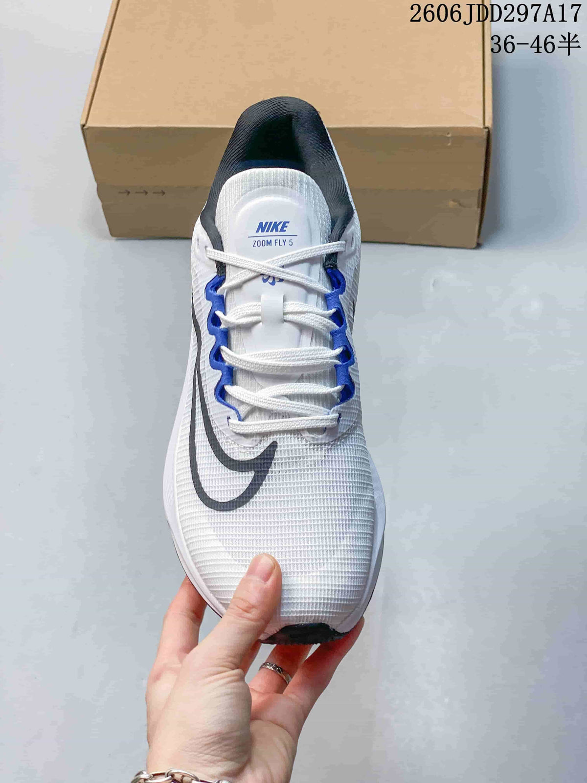 Top view of the white Nike Zoom Fly 5 shoe showing its laces and blue lace supports.