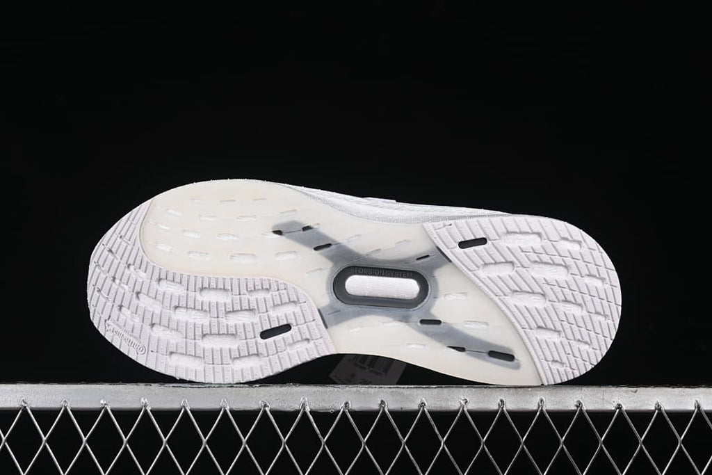 Underside view showing the patterned outsole and midfoot section.