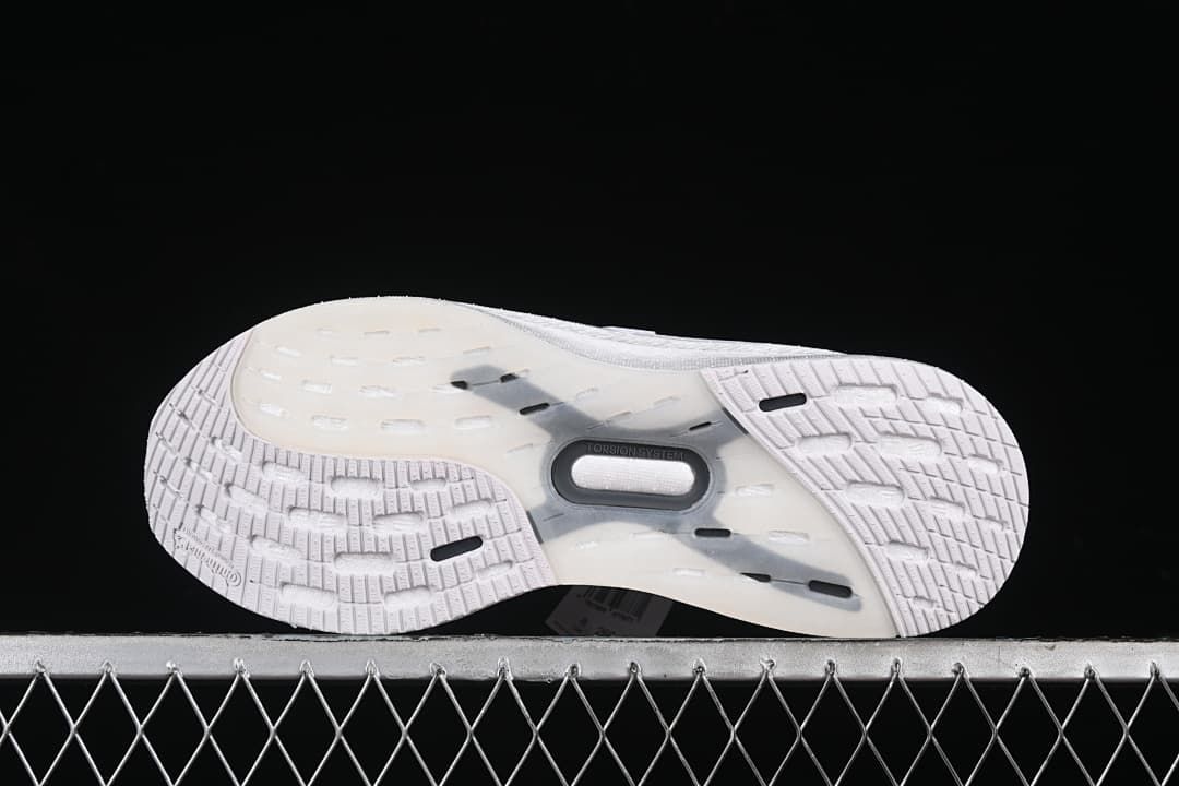 Underside view showing the patterned outsole and midfoot section.
