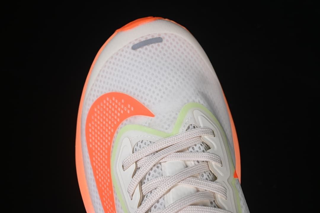 Top-down close-up of the mesh toe and lace area.