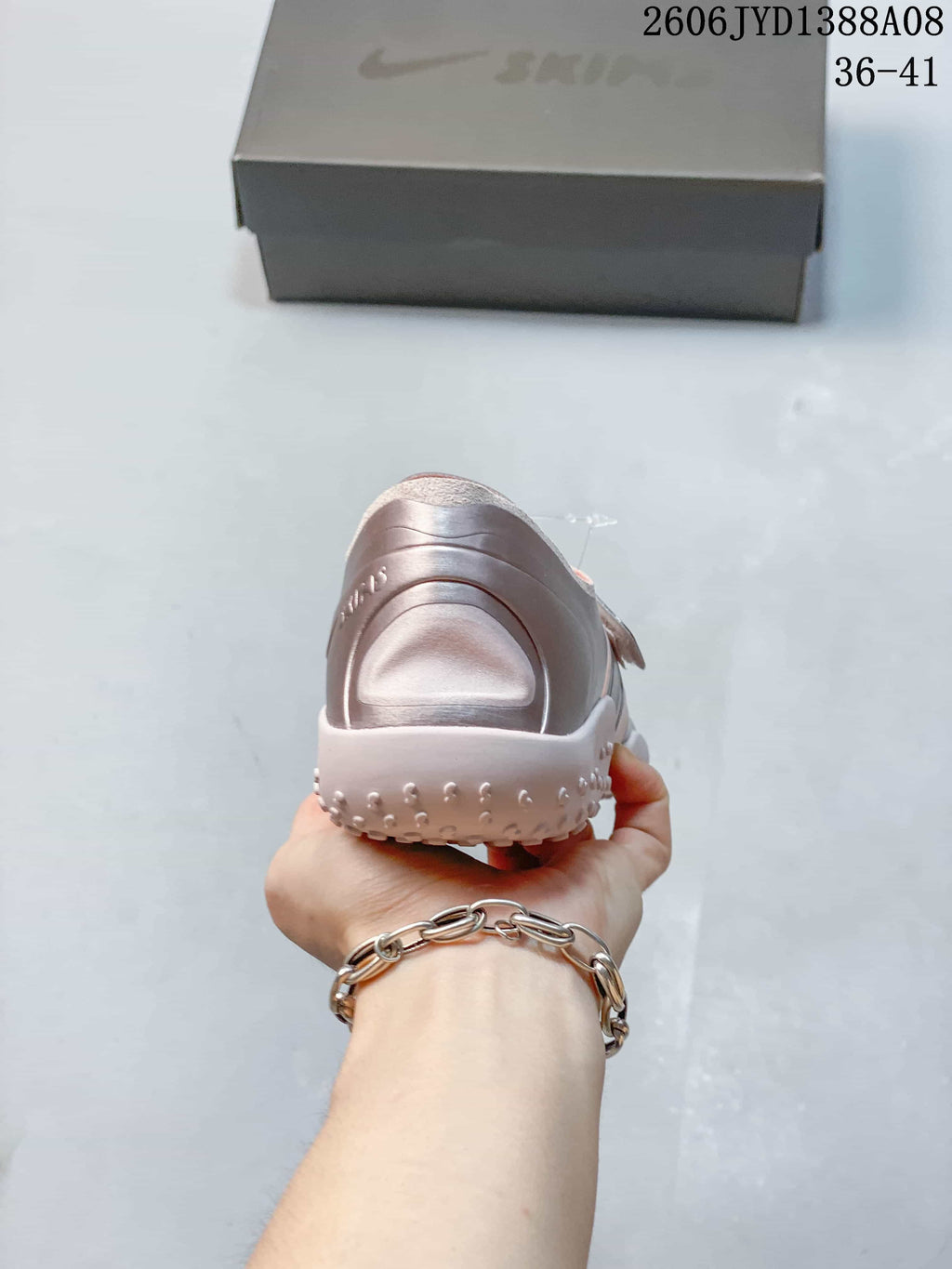 Rear view of a pink Nike Air Rift shoe