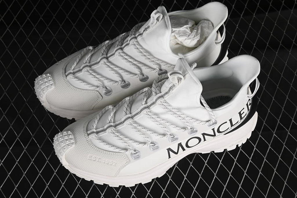 Pair of white Trailgrip Lite2 sneakers shown from above