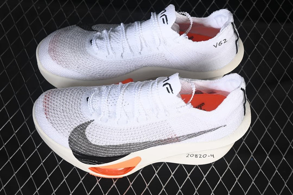 Pair of white Nike running sneakers shown from above and the side