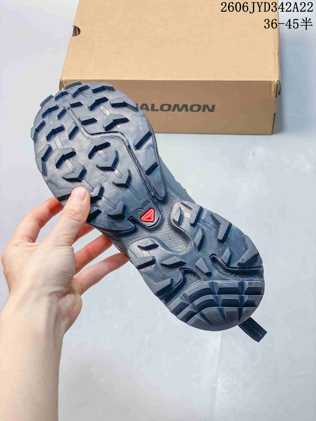 Underside of a Salomon sneaker showing its tread pattern