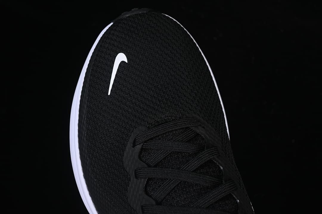 Top view of the black mesh-look toe and lace-up front