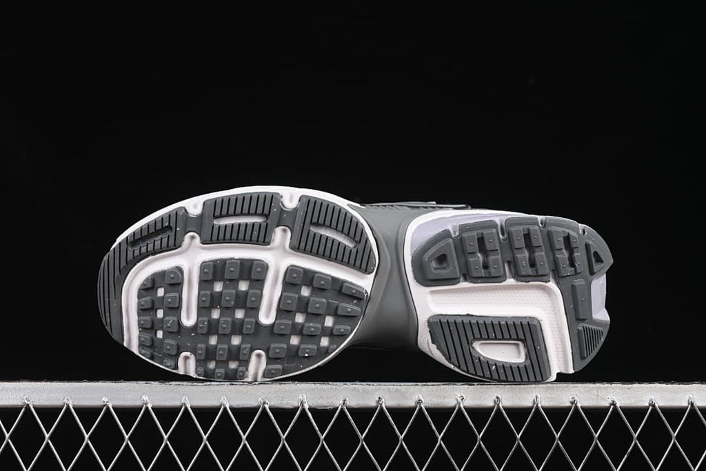 Underside view showing the tread pattern of both sneakers