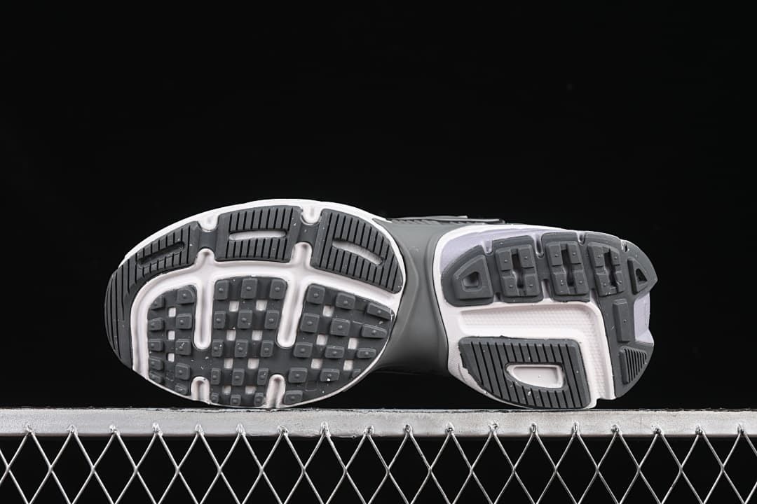 Underside view showing the tread pattern of both sneakers