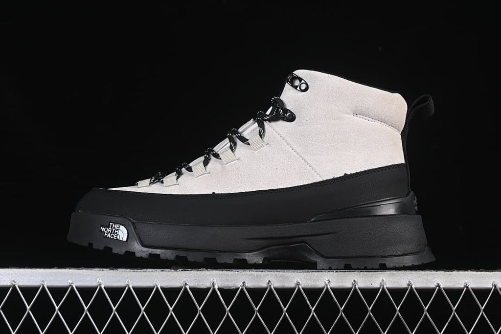 Side profile of light and black The North Face mid-height hiking boot