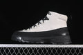 Side profile of light and black The North Face mid-height hiking boot