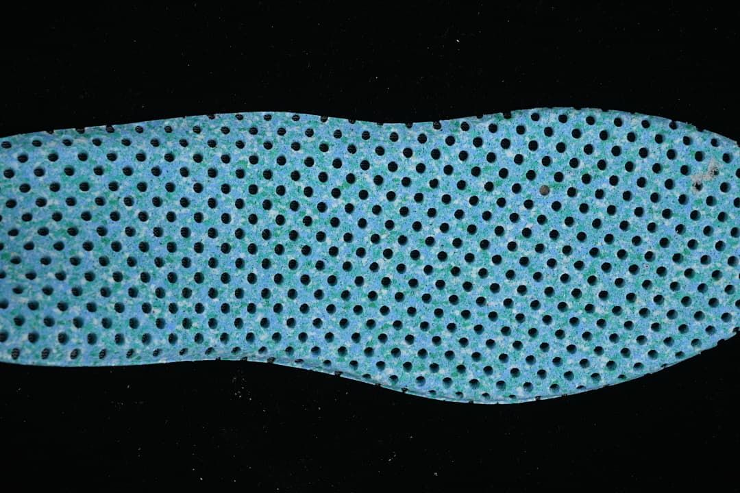 Close-up of a blue perforated shoe insert.