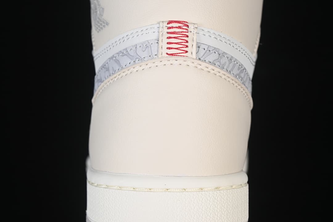 Rear view showing patterned heel trim and red stitching