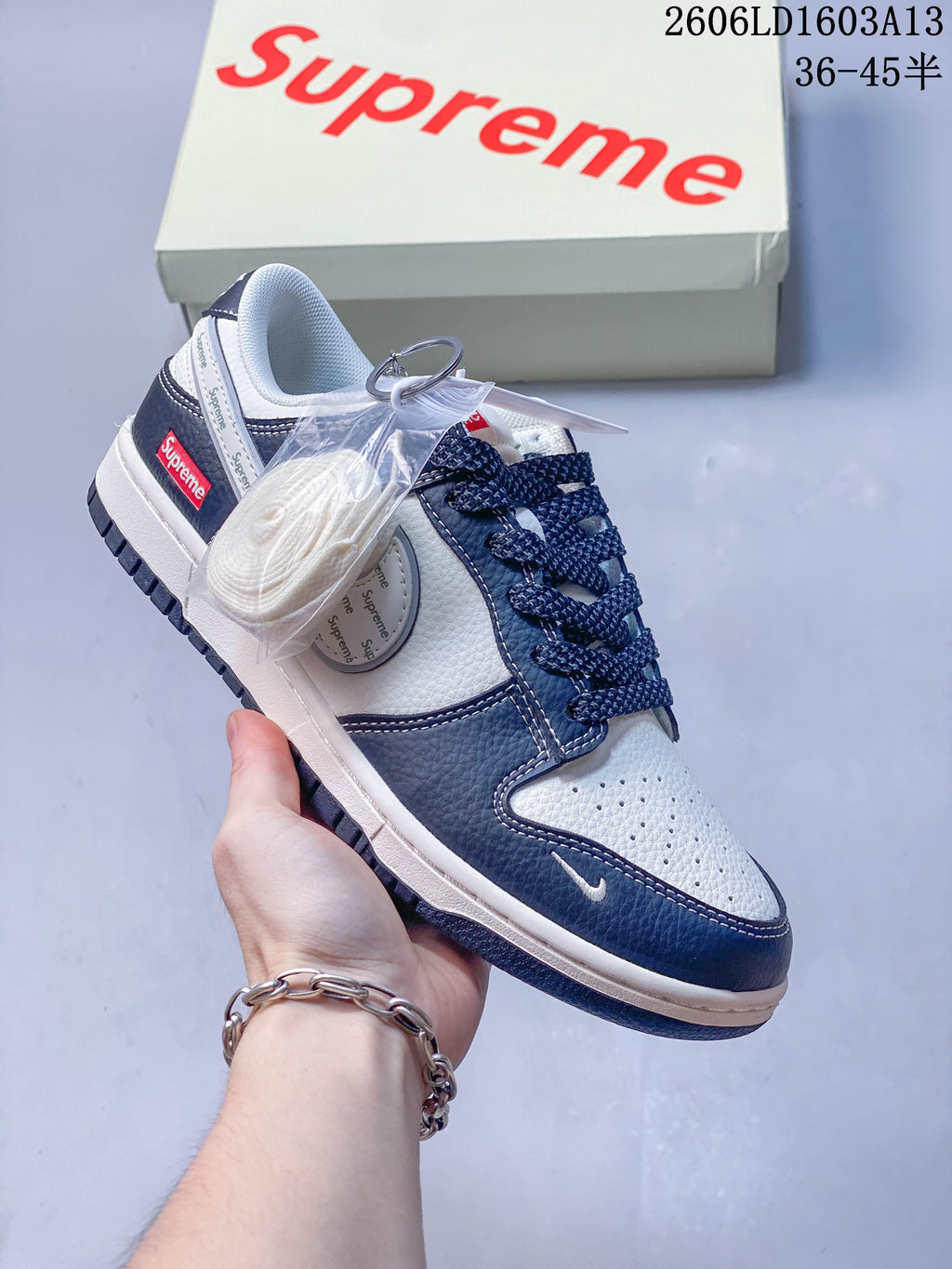 Angled view of the sneaker with an extra light-colored lace set