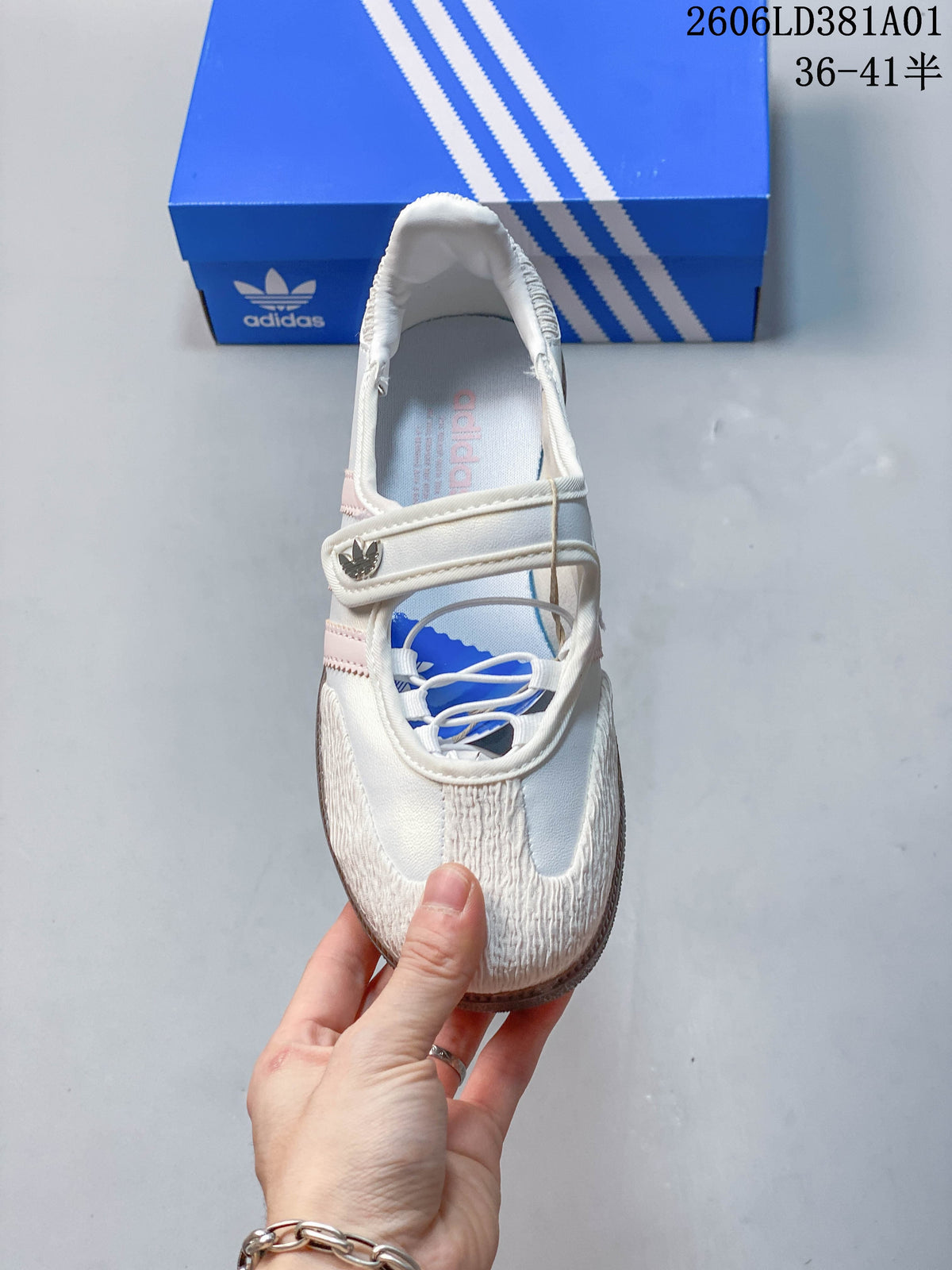 Top view of the sneaker showing the instep strap and laced opening