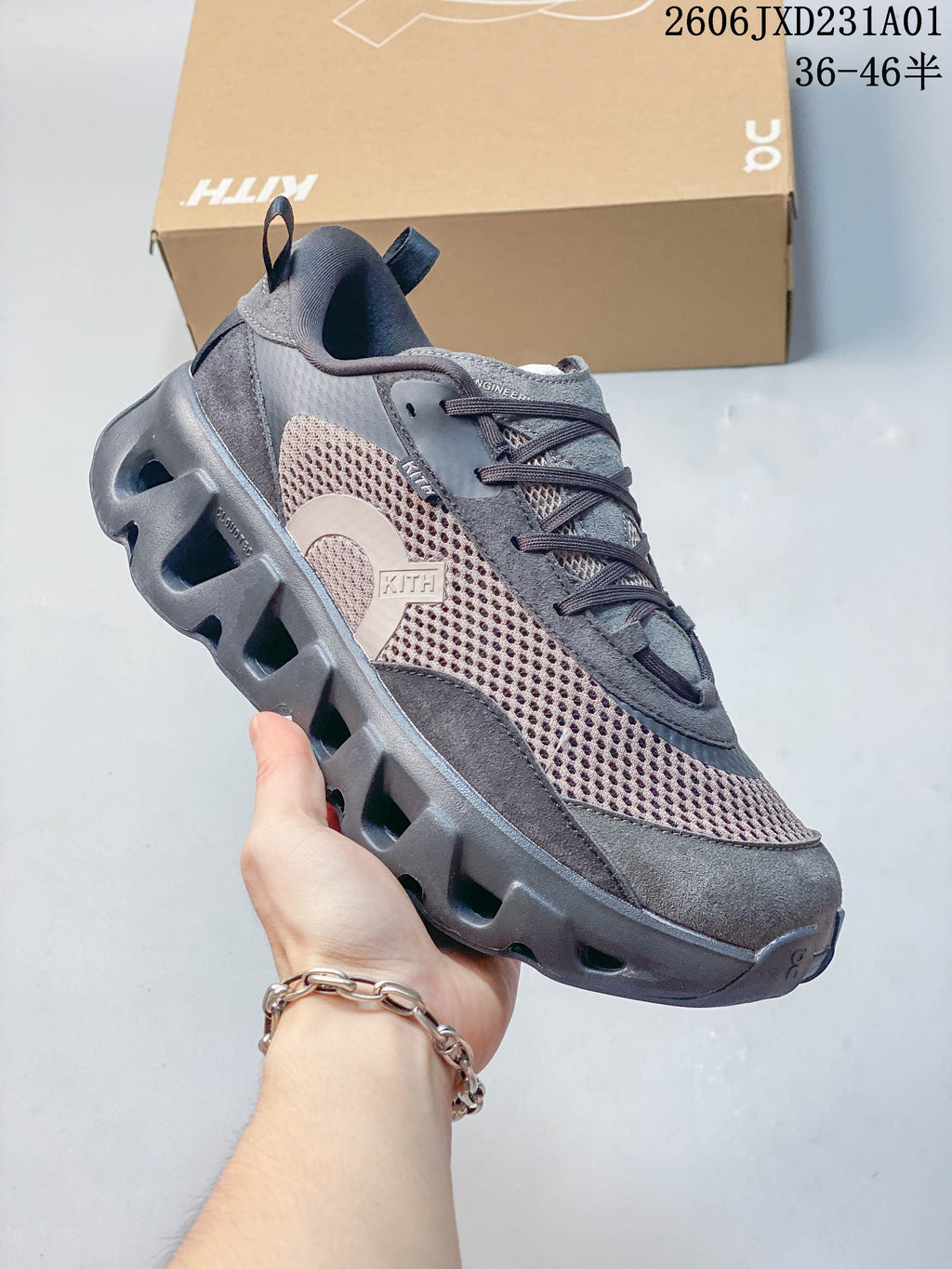 Angled side view of the brown and gray On x Kith K-Tech 2 sneaker