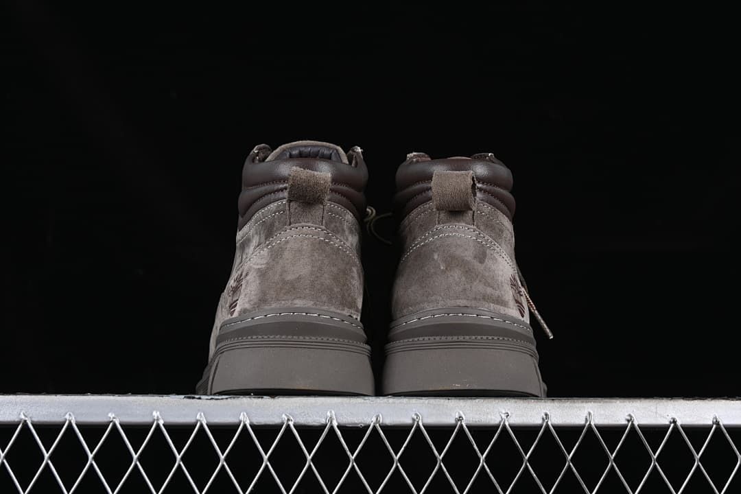 Rear view of both boots showing pull tabs and padded collars