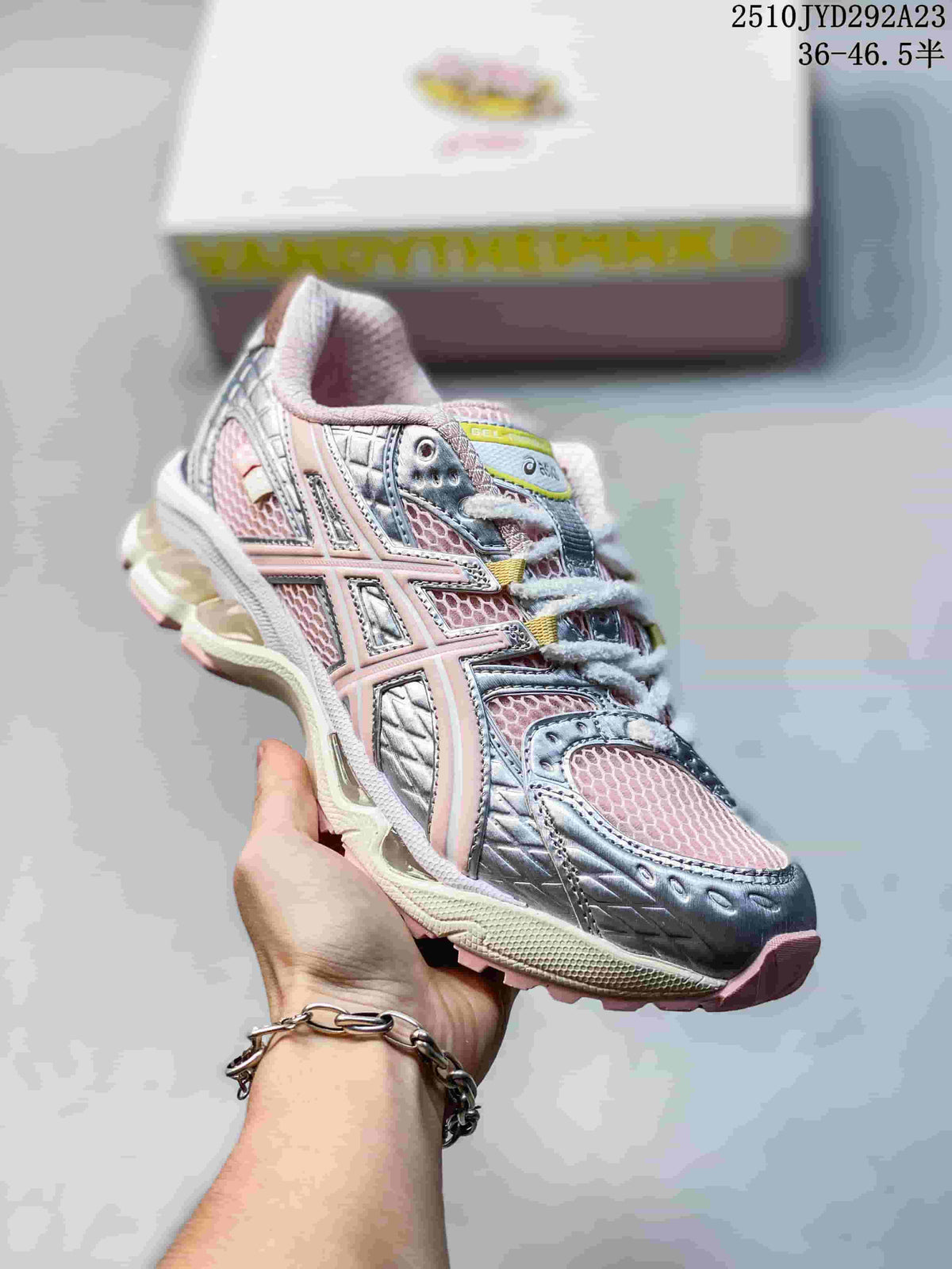 Angled side view of the pink and silver ASICS sneaker