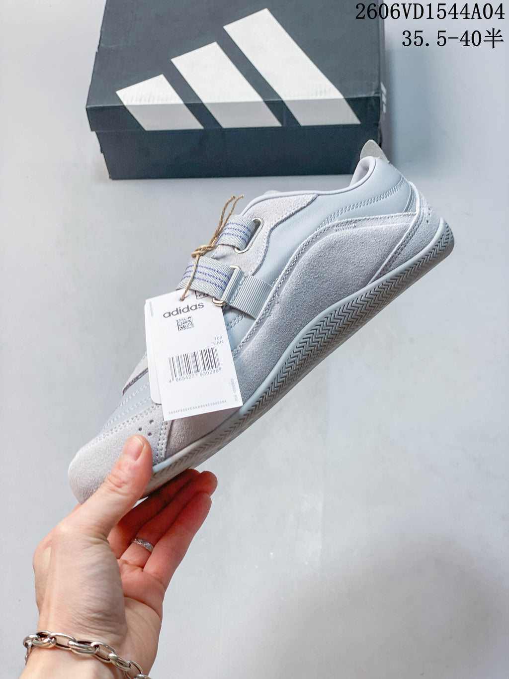 Side profile of the Adidas Urban Reverie sneaker with layered panels and striped straps