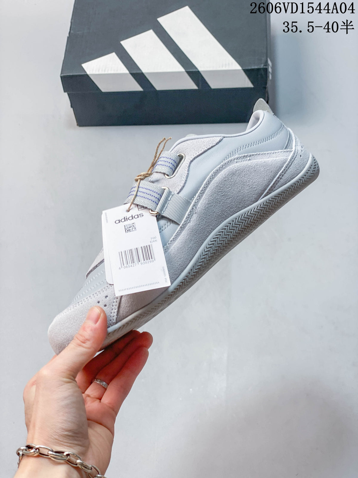 Side profile of the Adidas Urban Reverie sneaker with layered panels and striped straps
