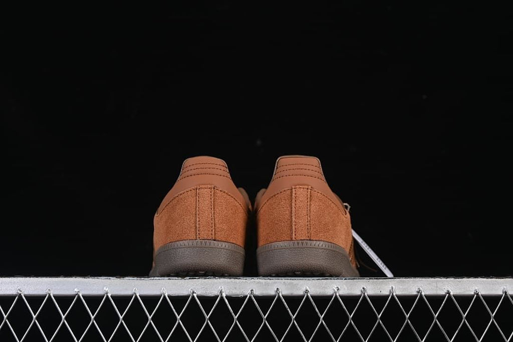 Rear view of both sneakers showing the heel panels
