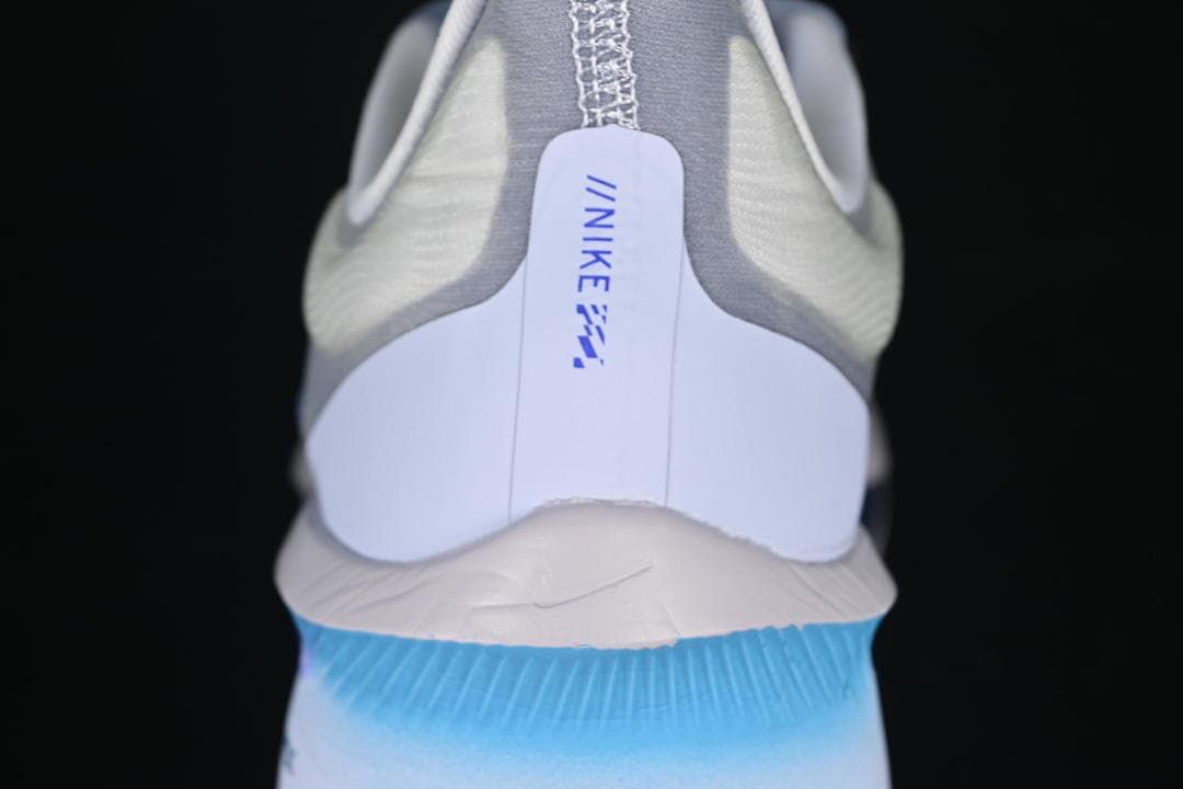 Rear view showing the heel and blue-to-cyan midsole detailing.